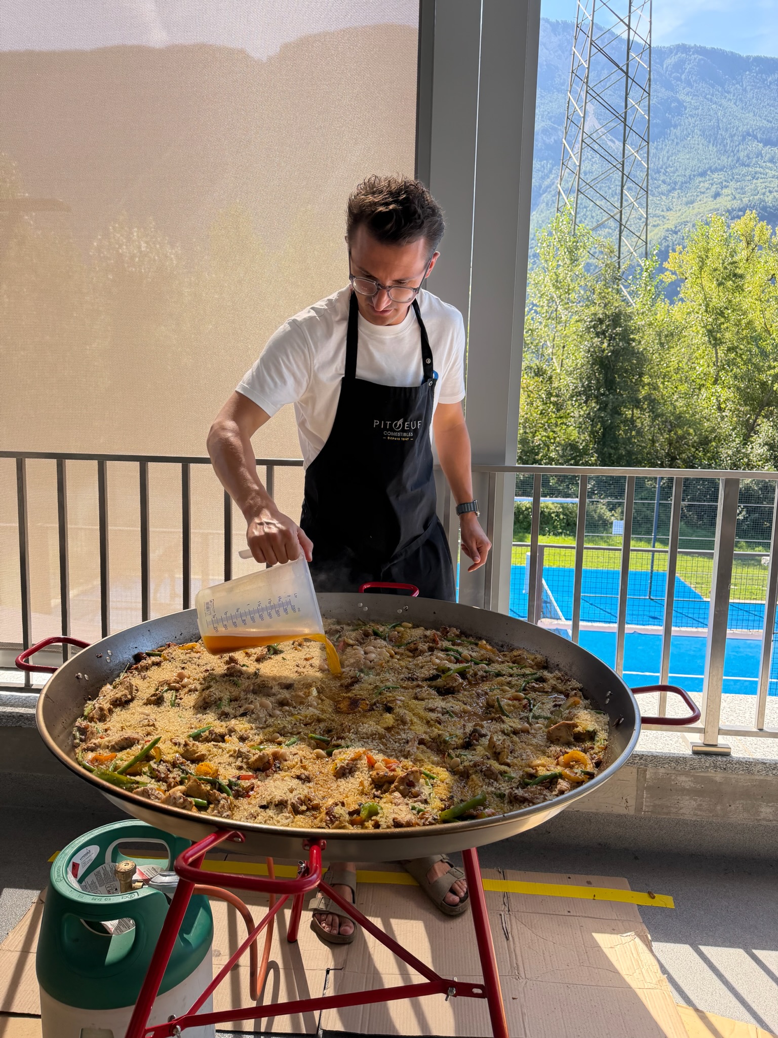 Preparing the paella at Rackets Academy Salgesch
